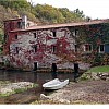 Great estate including a hotel, ancient mill stone and sandy beach on the river